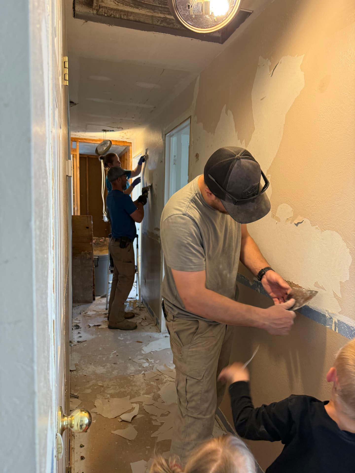 Crew completing interior tear-out inside a home
